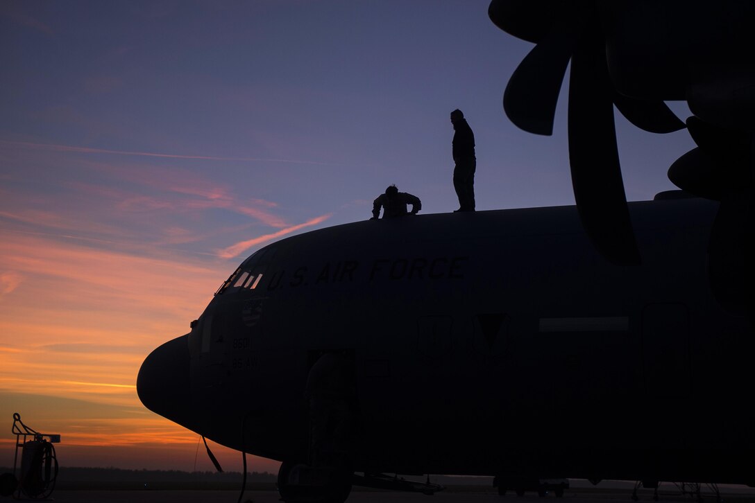U.S. airmen enter a C-130J Super Hercules aircraft after repairing a wing during Aviation Detachment 16-1 on Powidz Air Base, Poland, Oct. 27, 2015. The airmen, assigned to the 86th Aircraft Maintenance Squadron, flew to Poland to support the 37th Airlift Squadron as they complete training requirements. U.S. Air Force photo/Senior Airman Damon Kasberg