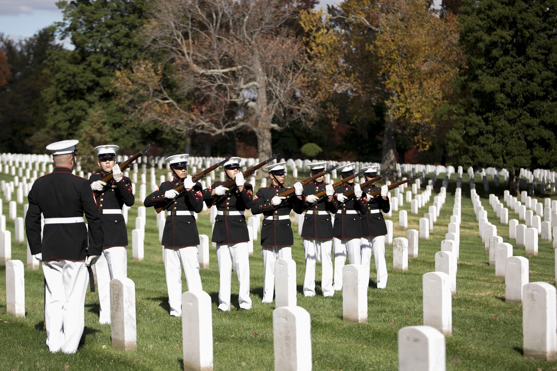 The Company B firing party, Marine Barracks Washington, D.C., fires three volleys during a full honors funeral for Lt. Gen. Frank E. Petersen Jr., retired, Oct. 30, 2015 at Arlington National Cemetery, Va. Petersen, the first African-American Marine Corps aviator and general, passed away Aug. 25, 2015. (U.S. Marine Corps Photo by Cpl. Chi Nguyen/Released)