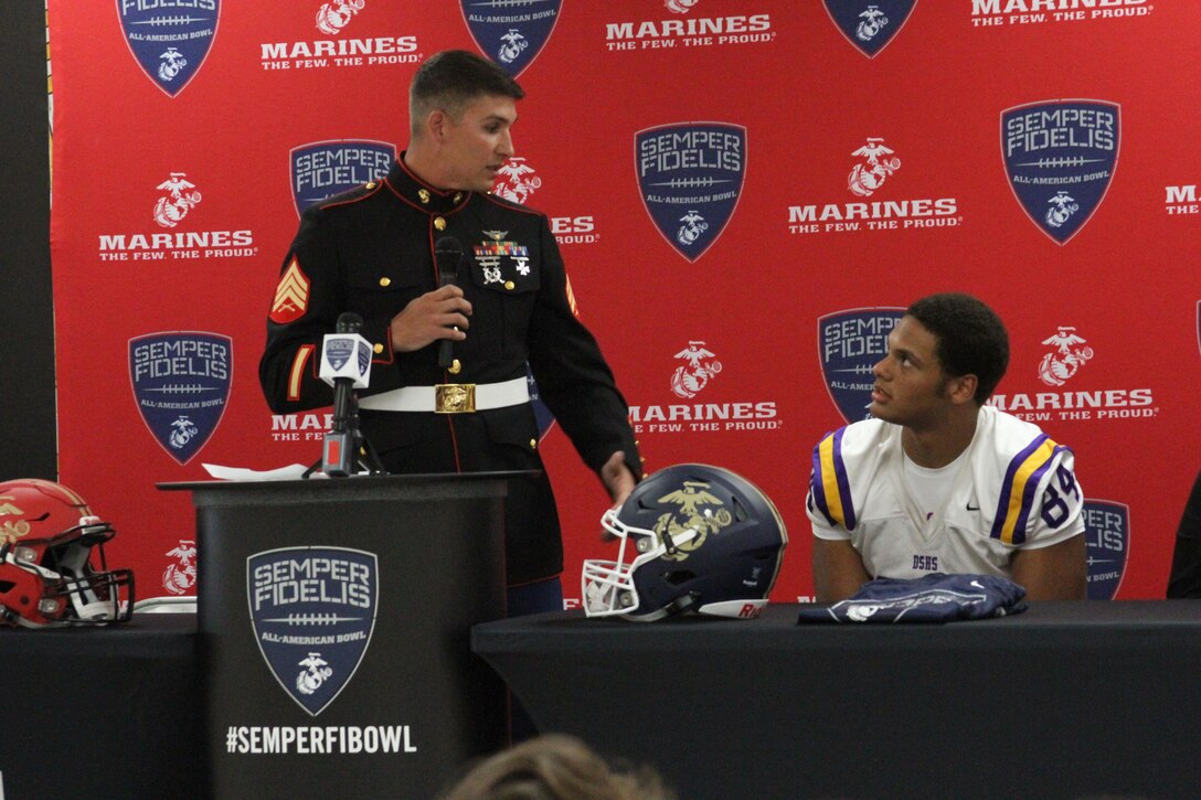 Sergeant Wesley Martins, a canvassing recruiter with Recruiting Sub-Station Baton Rouge North, speaks during the Semper Fidelis All-American Bowl jersey presentation for Caleb Roddy at Denham Springs High School Oct. 16, 2015. Roddy will be participating in the fifth annual Semper Fi Bowl taking place in Carson, California on Jan. 3, 2016.