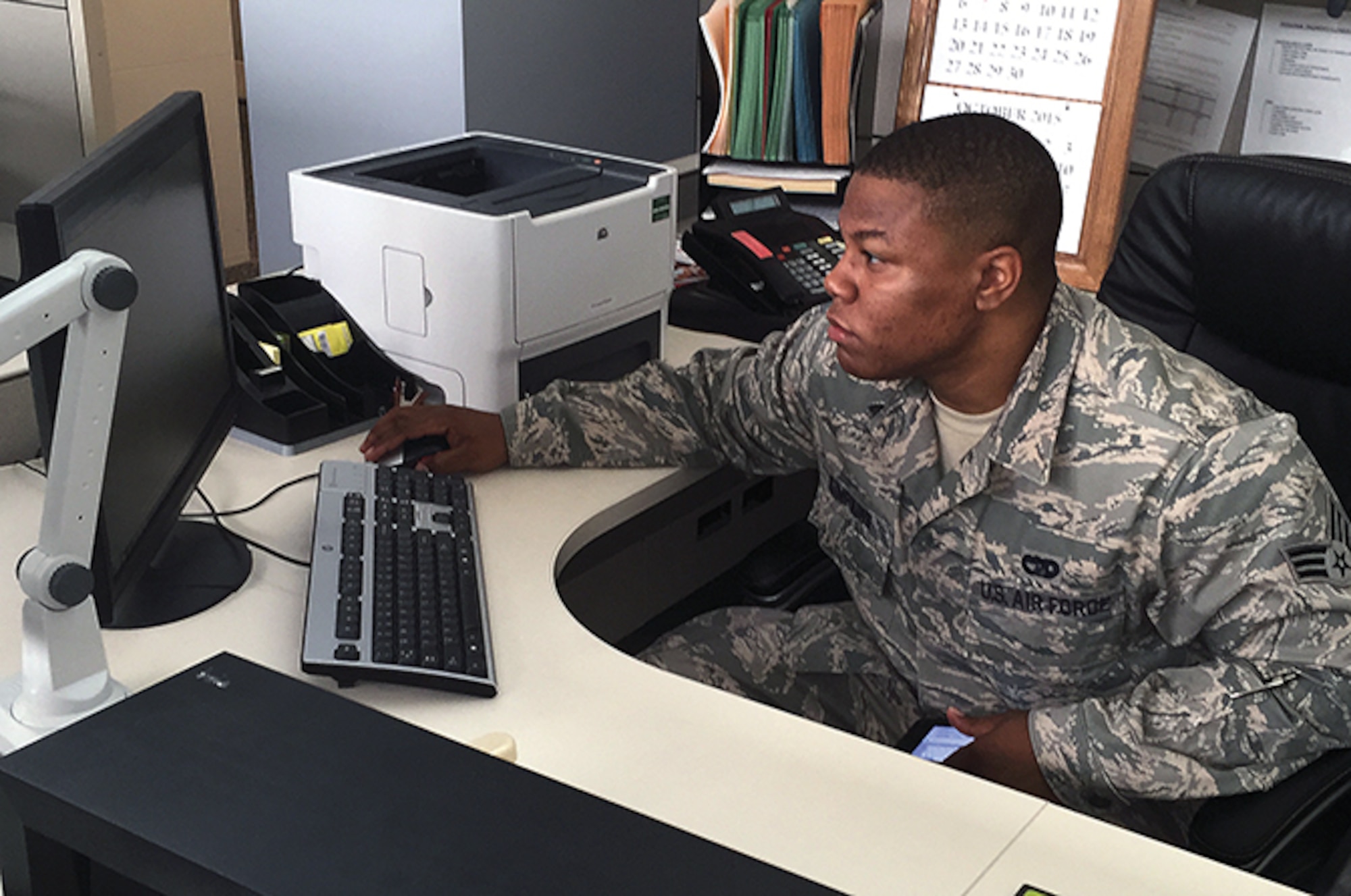 Senior Airman Jairius Simpkins uses software to track real-time cargo movements. (U.S. Air Force/Courtesy Photo)