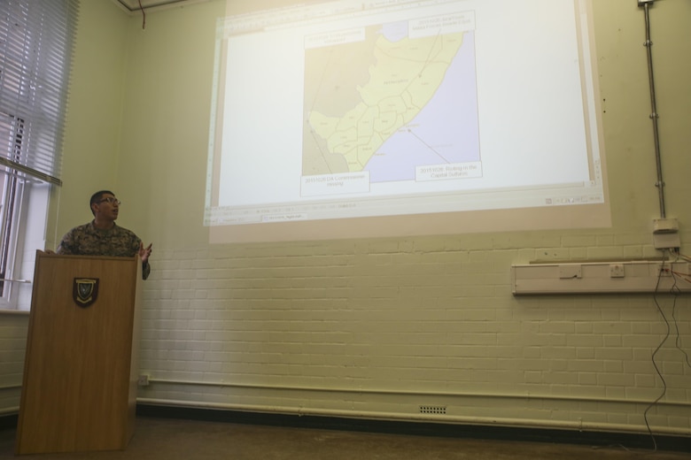 U.S. Marine Cpl. Manuel Lazo, an intelligence specialist with 2nd Intelligence Battalion, gives a brief during Exercise Phoenix Odyssey II in Edinburgh, U.K., Oct. 27, 2015. Lazo is one of approximately 70 Marines participating in EPO II, which is built to strengthen intelligence operations between the U.S. and British Army. (U.S. Marine Corps photo by Cpl. Lucas Hopkins/Released)