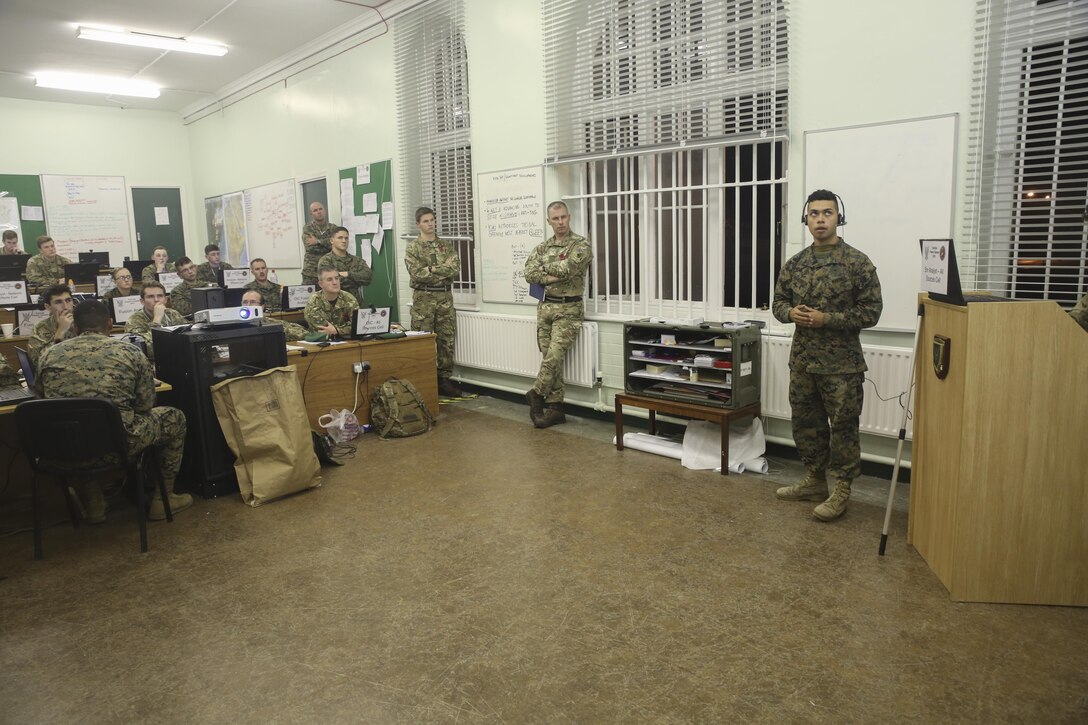 U.S. Marine Pfc. Jahaziel Ariasbosa, right, an intelligence specialist with 2nd Intelligence Battalion, gives a brief other Marines and British soldiers during Exercise Phoenix Odyssey II in Edinburgh, U.K., Oct. 28, 2015. The exercise is designed to increase the intelligence capabilities of both nations while operating in a joint environment. (U.S. Marine Corps photo by Cpl. Lucas Hopkins/Released)