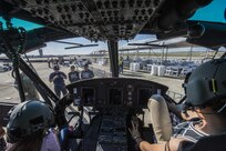 Visitors of the Joint Base San Antonio Air Show and Open House sit inside of a UH-1 Iroquois Nov. 1, 2015, at JBSA-Randolph, Texas. JBSA  air show allowed attendees to get up close and personal to see some of the equipment and aircraft used by the past and present U.S. military.