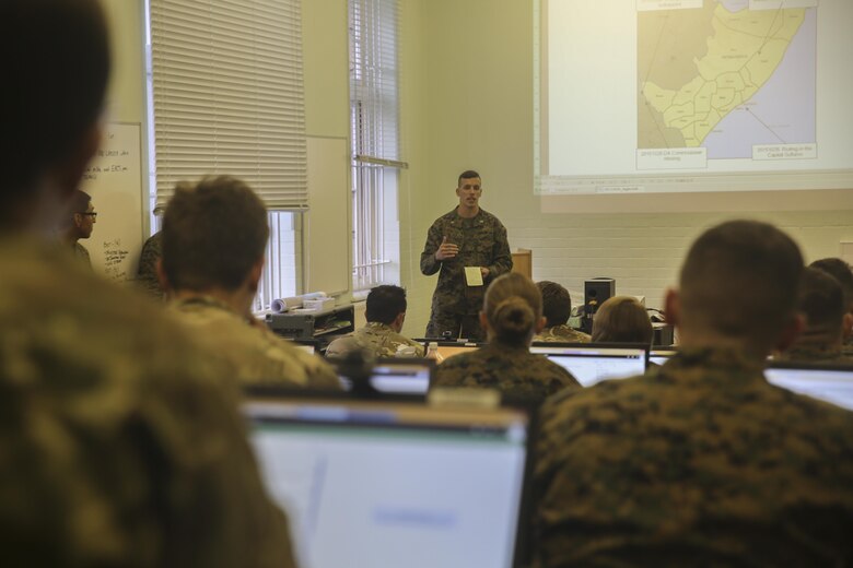 U.S. Marine 1st Lt. Benton Pittman, an air intelligence officer with 2nd Intelligence Battalion, gives a brief to Marines and British soldiers during Exercise Phoenix Odyssey II in Edinburgh, U.K., Oct. 27, 2015. The second iteration of EPO is designed to build the partnerships and joint intelligence capabilities between the two services. (U.S. Marine Corps photo by Cpl. Lucas Hopkins/Released)