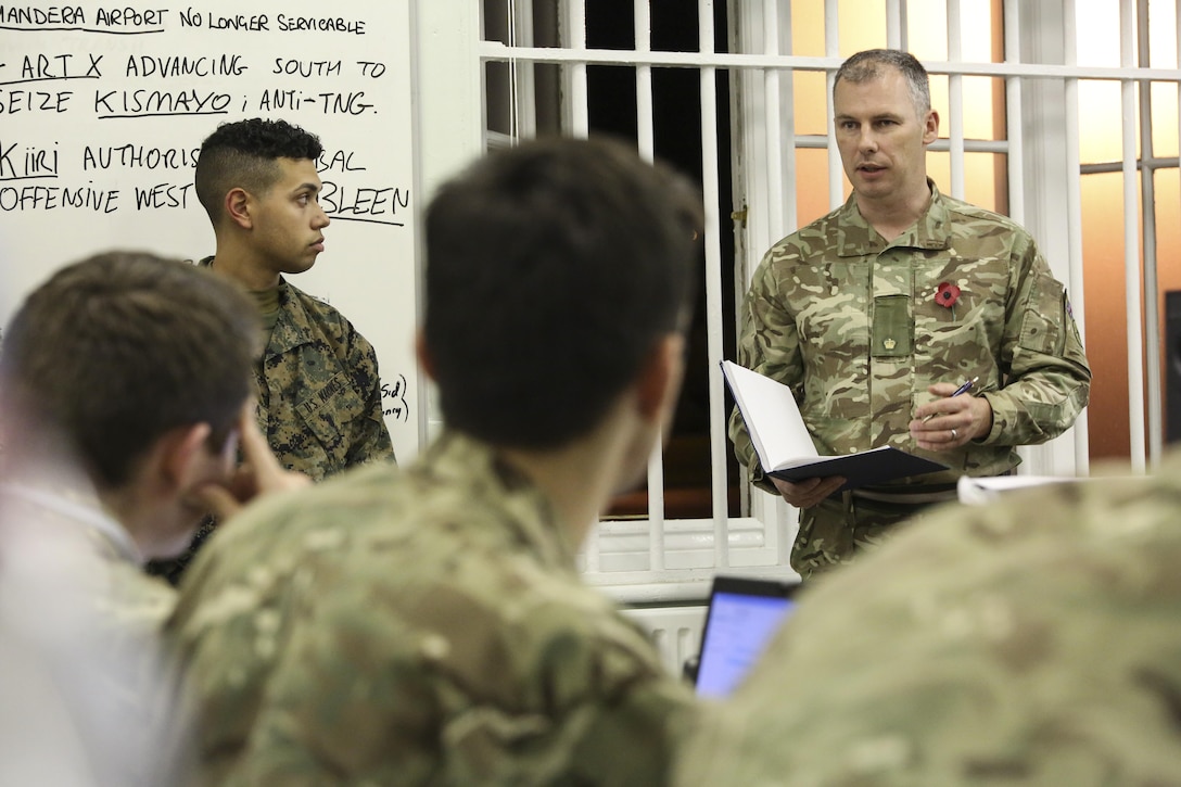 A British soldier briefs other soldiers and U.S. Marines with 2nd Intelligence Battalion during Exercise Phoenix Odyssey II in Edinburgh, U.K., Oct. 28, 2015. The nations are collaborating for the two-week exercise in order to increase intelligence proficiencies while working in joint scenarios. (U.S. Marine Corps photo by Cpl. Lucas Hopkins/Released)