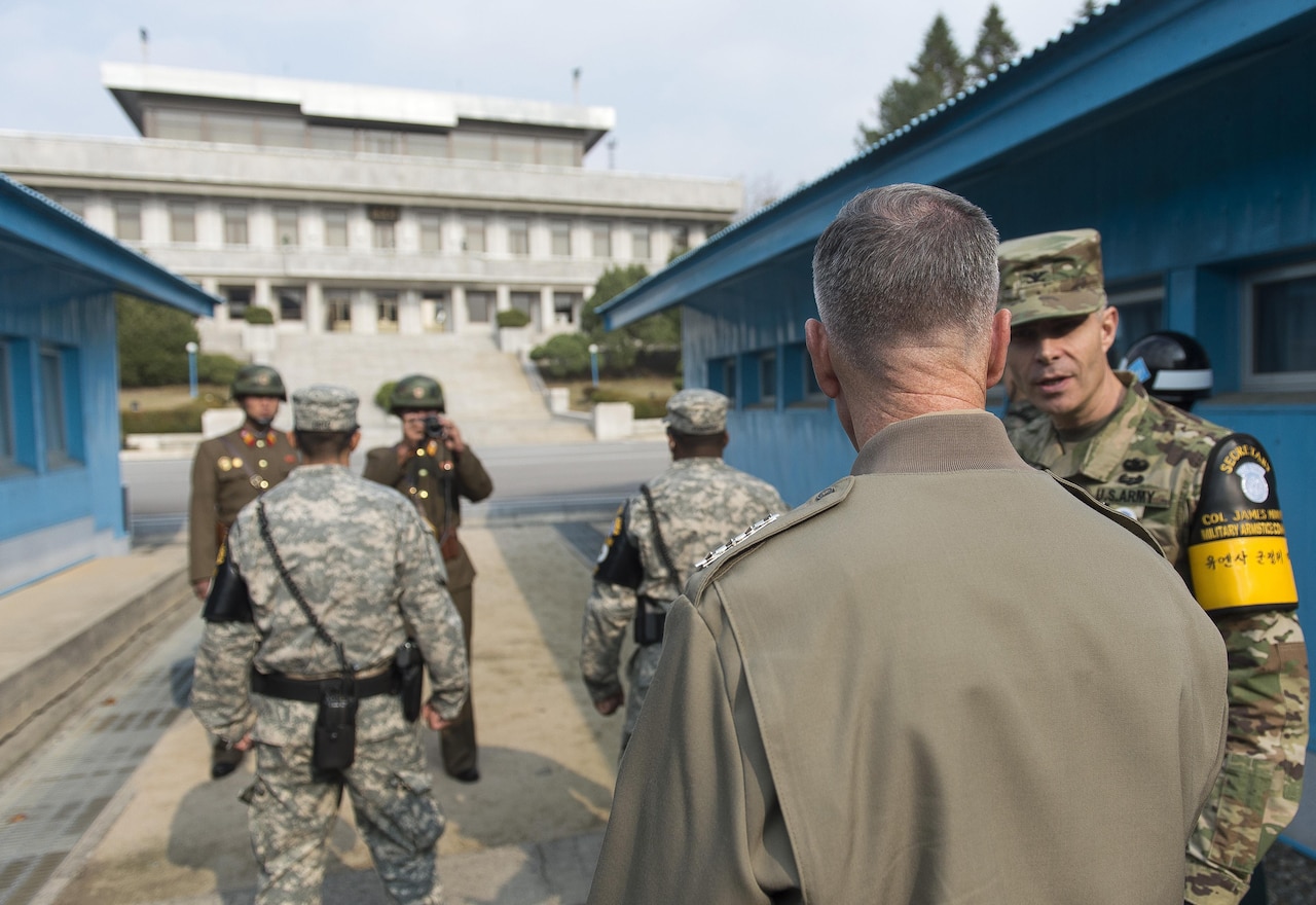 Marine Corps Gen. Joseph F. Dunford Jr., 19th Chairman of the Joint Chiefs of Staff, is briefed by U.S. Army Col. James Minnich, secretary of the United Nations Command Military Armistice Commission, during his visit to the Demilitarized Zone in the Republic of Korea, Nov. 2, 2015 (DoD photo by Navy Petty Officer 2nd Class Dominique A. Pineiro)