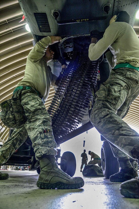 Staff Sgt.Woodrow Walkup and Senior Airman Kameron Whitener, 25th Aircraft Maintenance Unit weapons load crew team members, prepare to load 30 millimeter rounds onto an A-10 Thunderbolt II during the Vigilant Ace 16 exercise on Osan Air Base, Republic of Korea, Nov. 1, 2015. The A-10 is a highly accurate and survivable weapons-delivery platform, capable of carrying up to 16,000 pounds of munitions including the 30 millimeter cannon which can penetrate tanks. (U.S. Air Force photo/Senior Airman Kristin High)