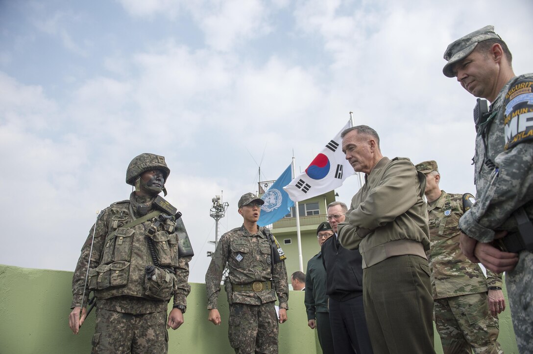 U.S. Marine Corps Gen. Joseph F. Dunford Jr., chairman of the Joint Chiefs of Staff, listens to a South Korean soldier brief him during a trip to the Demilitarized Zone in South Korea, Nov. 2, 2015. DoD photo by U.S. Navy Petty Officer 2nd Class Dominique A. Pineiro