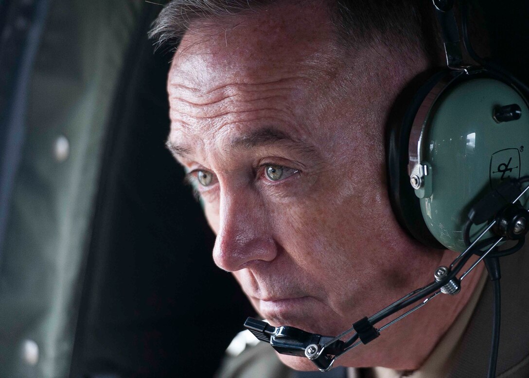 U.S. Marine Corps Gen. Joseph F. Dunford Jr., chairman of the Joint Chiefs of Staff, travels aboard a helicopter to the Demilitarized Zone that divides North Korea and South Korea, Nov. 2, 2015. DoD photo by U.S. Navy Petty Officer 2nd Class Dominique A. Pineiro