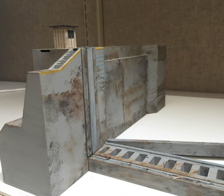 This model of the Emsworth Lock in Pittsburgh,Pennsylvania,is an example of
how engineers can use additive manufacturing,
also known as 3D printing, to create life-like models of their engineering designs.