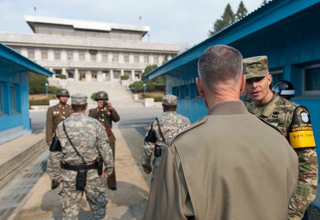 U.S. Marine Corps Gen. Joseph F. Dunford Jr., right foreground, chairman of the Joint Chiefs of Staff, talks with U.S. Army Col. James Minnich, secretary of the U.N. Command Military Armistice Commission, during his visit to the Demilitarized Zone in South Korea, Nov. 2, 2015. DoD photo by U.S. Navy Petty Officer 2nd Class Dominique A. Pineiro