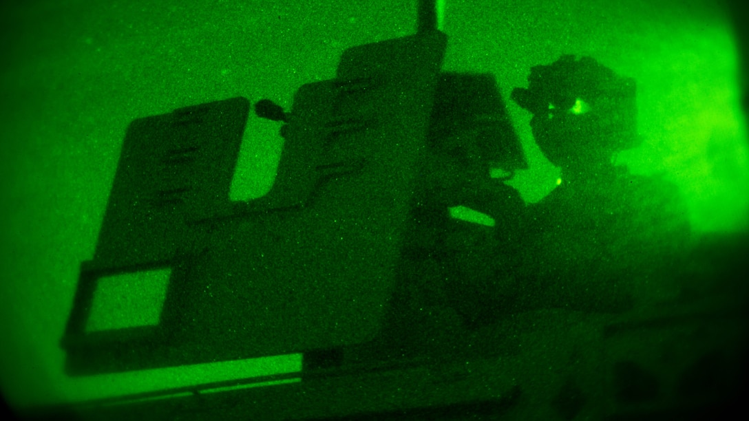 A Marine with Company C, 1st Marine Raider Battalion, Marine Corps Forces, Special Operations Command provides security during a night raid aboard Marine Corps Base Camp Pendleton, Calif., Oct. 9, 2015. Marine Special Operations Company C spent the first phase of their three-phase Company Collective Exercise practicing Foreign Internal Defense aboard Marine Corps Base Camp Pendleton, Calif., Oct. 5-8.