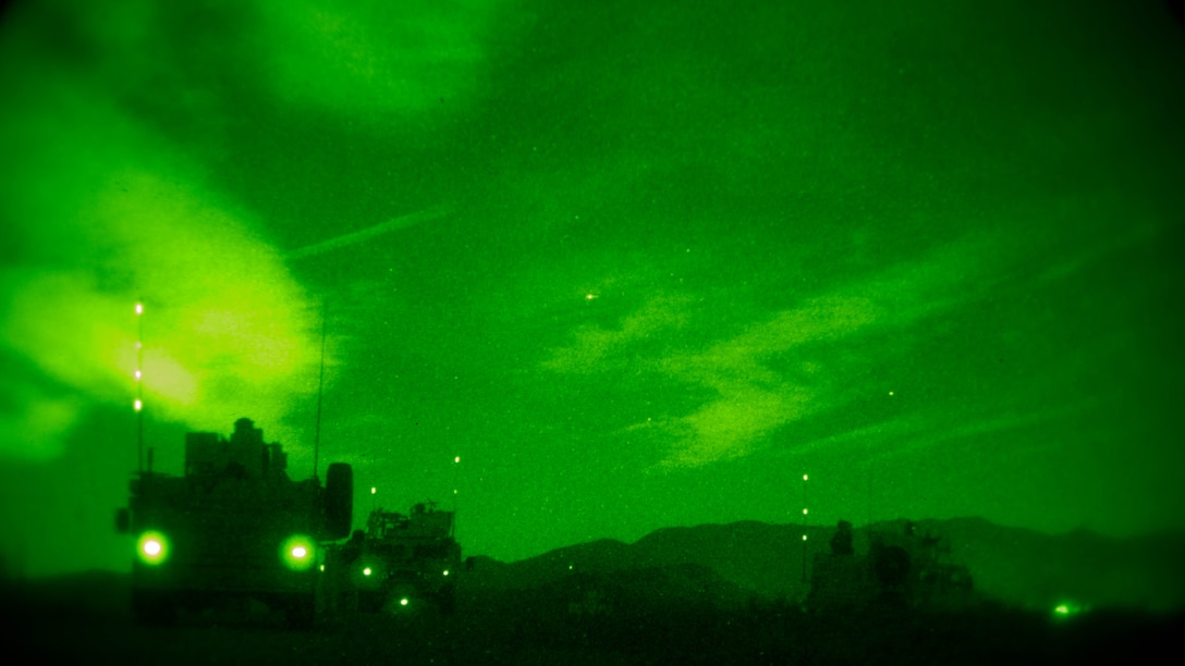 Humvees and All-Terrain Vehicles depart from a night raid aboard Marine Corps Base Camp Pendleton, Calif., Oct. 9, 2015. Marine Special Operations Company C spent the first phase of their three-phase Company Collective Exercise practicing Foreign Internal Defense aboard Marine Corps Base Camp Pendleton, Calif., Oct. 5-8.