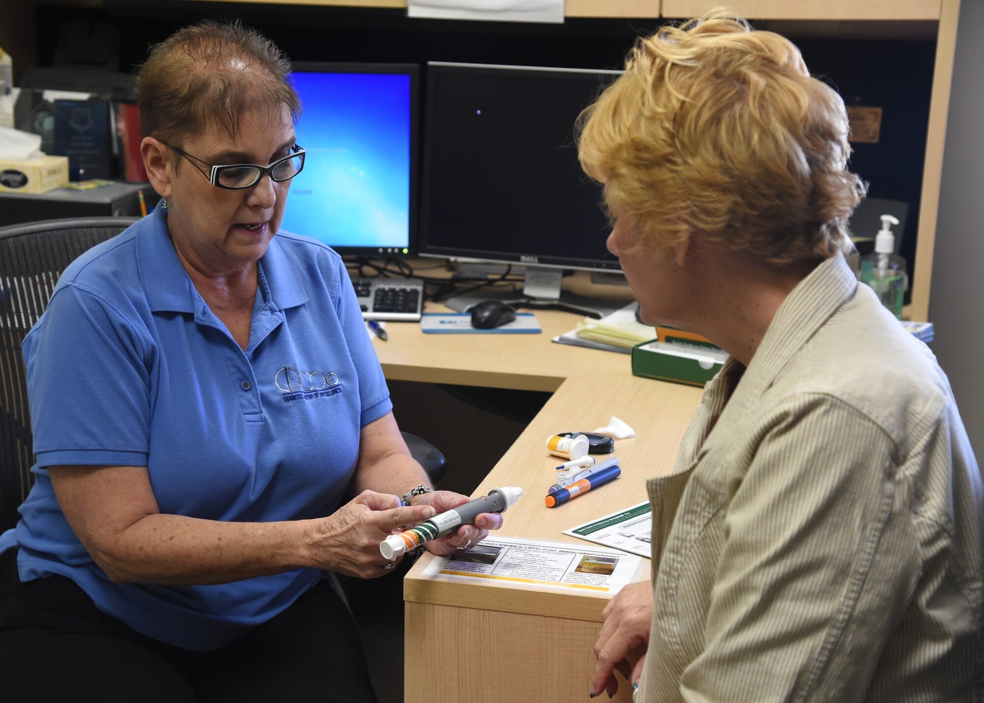 Lois Wingate, Diabetes Center of Excellence nurse manager, talks with Dr. Jana Wardian about management of complex diabetes and insulin titration. The DCOE offers a virtual diabetes classroom where individuals from other bases can attend and get American Diabetes Association recognized education.