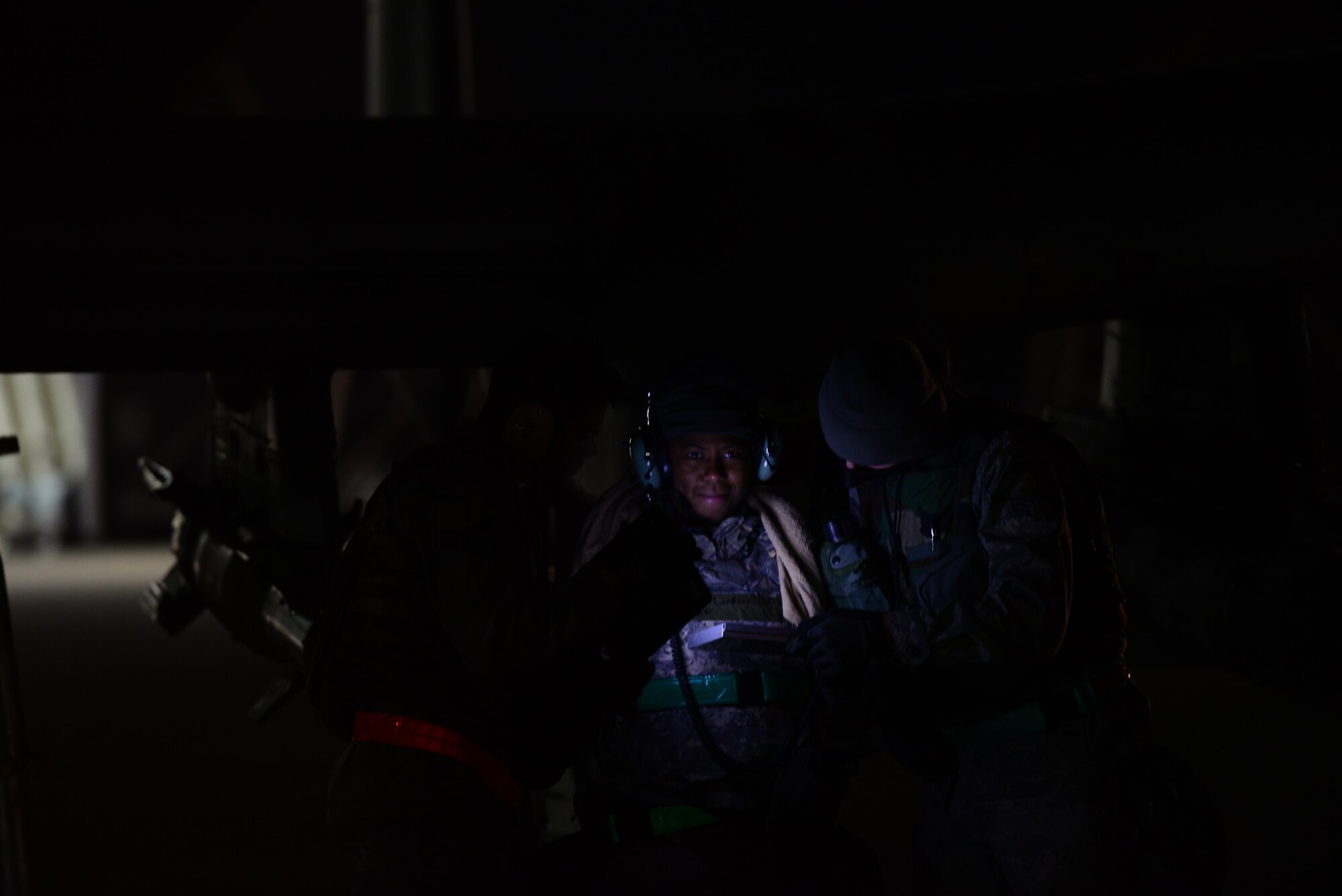 Staff Sgt. Tamika Lindsey, 25th Aircraft Maintenance Unit load master, reviews system operational guidelines with her crew during the first night of Vigilant Ace 16 at Osan Air Base, Republic of Korea, Nov. 2, 2015. Vigilant Ace is a peninusla wide operational readiness exercise geared toward strengthing the interoperability of the ROK/U.S.  alliance
(U.S. Air Force photo/Staff Sgt. Amber Grimm)