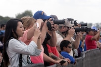 Visitors take photos during the 2015 Joint Base San Antonio Air Show and Open House Nov. 1, 2015 at JBSA-Randolph, Texas. Air shows allow the Air Force to display the capabilities of our aircraft to the American taxpayer through aerial demonstrations and static displays and allowing attendees to get up close and personal to see some of the equipment and aircraft used by the U.S. military today. (U.S. Air Force photo by Johnny Saldivar) 
