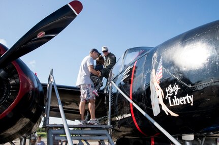 Visitors get a close up view of a Douglas A-26 Invader during the 2015 Joint Base San Antonio Air Show and Open House Nov. 1, 2015 at JBSA-Randolph, Texas. Air shows allow the Air Force to display the capabilities of our aircraft to the American taxpayer through aerial demonstrations and static displays and allowing attendees to get up close and personal to see some of the equipment and aircraft used by the U.S. military today. (U.S. Air Force photo by Johnny Saldivar) 
