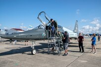 Visitors get a close up view of a T-38 during the 2015 Joint Base San Antonio Air Show and Open House Nov. 1, 2015 at JBSA-Randolph, Texas. Air shows allow the Air Force to display the capabilities of our aircraft to the American taxpayer through aerial demonstrations and static displays and allowing attendees to get up close and personal to see some of the equipment and aircraft used by the U.S. military today. (U.S. Air Force photo by Johnny Saldivar) 
