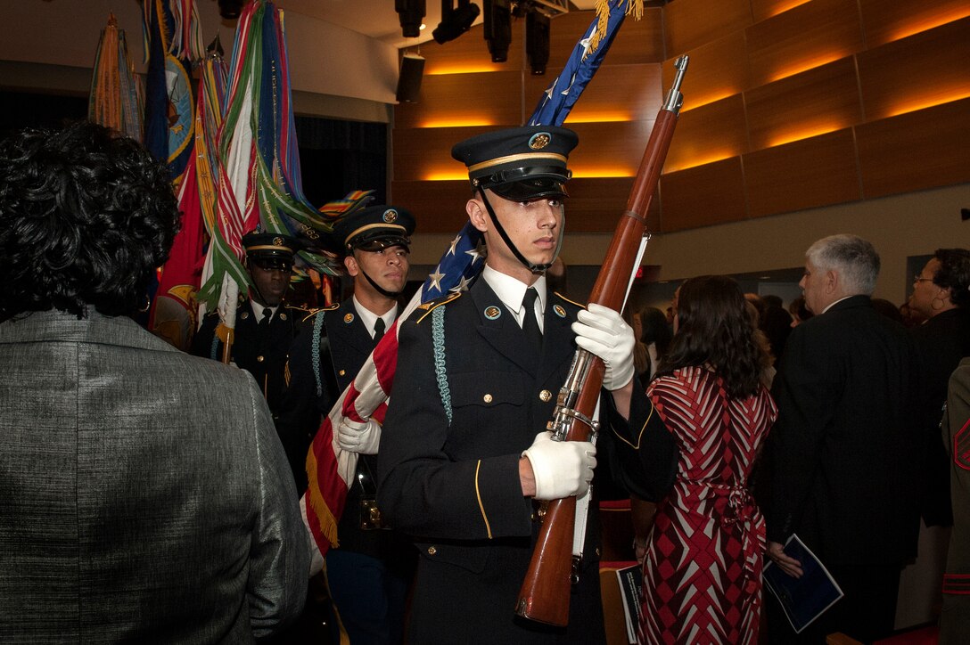 Color guard members and soldiers with the U.S. Army Old Guard Fife and Drum Corps participate in the presentation of colors during the Defense Department's 35th Annual Disability Awards Ceremony at the Pentagon, Oct. 29, 2015. DoD photo by Marvin Lynchard