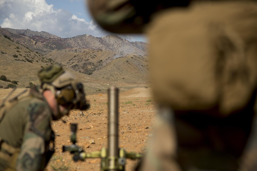 Marines with 1st Marine Raider Battalion fire 60 mm mortars during a Company Collective Exercise aboard Marine Corps Base Camp Pendleton, Calif., Oct. 7, 2015. Marine Special Operations Company C, 1st Marine Raider Battalion, U.S. Marine Corps Forces, Special Operations Command spent the first phase of their three-phase Company Collective Exercise practicing Foreign Internal Defense aboard Marine Corps Base Camp Pendleton, Calif., Oct. 5-8.