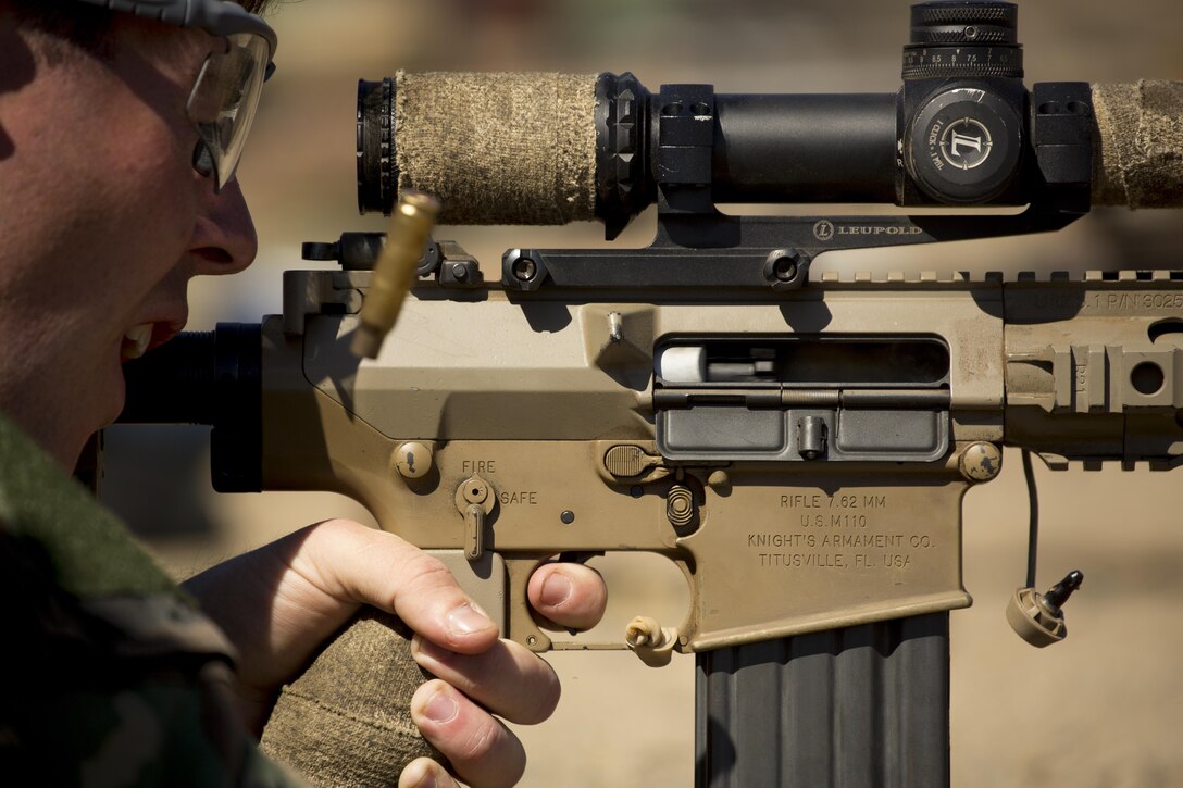 A Marine with Company C, 1st Marine Raider Battalion, U.S. Marine Corps Forces, Special Operations Command fires at distant, static targets during a Company Collective Exercise aboard Marine Corps Base Camp Pendleton, Calif., Oct. 7, 2015. Marine Special Operations Company C spent the first phase of their three-phase Company Collective Exercise practicing Foreign Internal Defense aboard Marine Corps Base Camp Pendleton, Calif., Oct. 5-8.