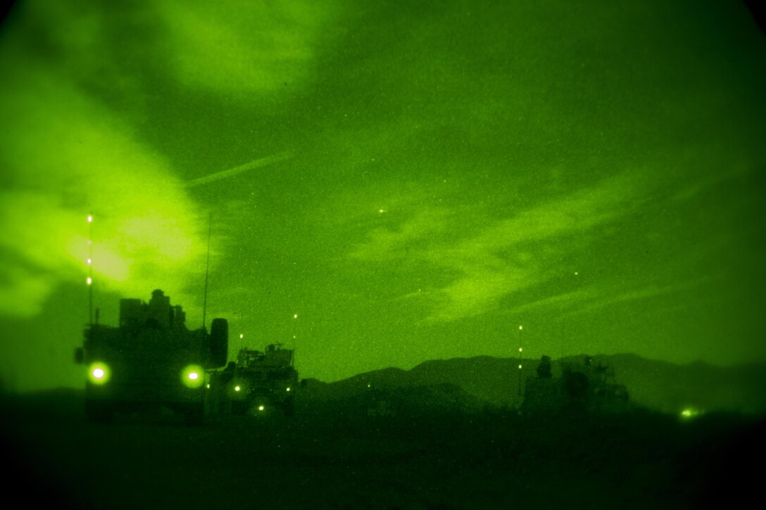 Humvees and All-Terrain Vehicles depart from a night raid aboard Marine Corps Base Camp Pendleton, Calif., Oct. 9, 2015. Marine Special Operations Company C spent the first phase of their three-phase Company Collective Exercise practicing Foreign Internal Defense aboard Marine Corps Base Camp Pendleton, Calif., Oct. 5-8.