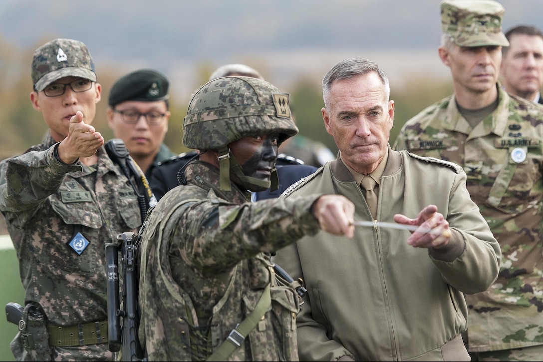 U.S. Marine Corps Gen. Joseph F. Dunford Jr., chairman of the Joint Chiefs of Staff, listens to a South Korean soldier brief him during a trip to the Demilitarized Zone in South Korea, Nov. 2, 2015. DoD photo by U.S. Navy Petty Officer 2nd Class Dominique A. Pineiro
