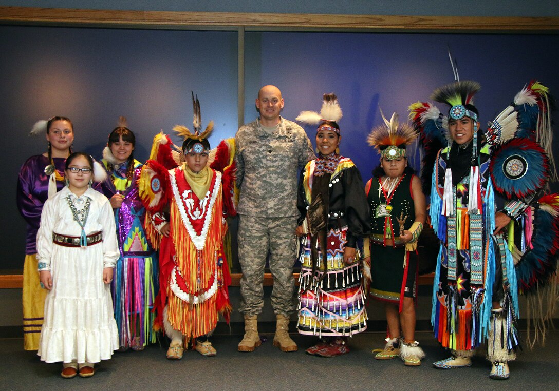 Lt. Col. Daniel Young, Deputy Commander, Tulsa District U.S. Army Corps of Engineers, stands for a group photo with the Owasso Indian Education Dance Group during a ceremony held Nov. 2, 2015 at the Tulsa District office. The Tulsa District held the ceremony in recognition of National American Indian Heritage Month which is celebrated throughout the month of November 2015. (Photo by Preston Chasteen/Released)