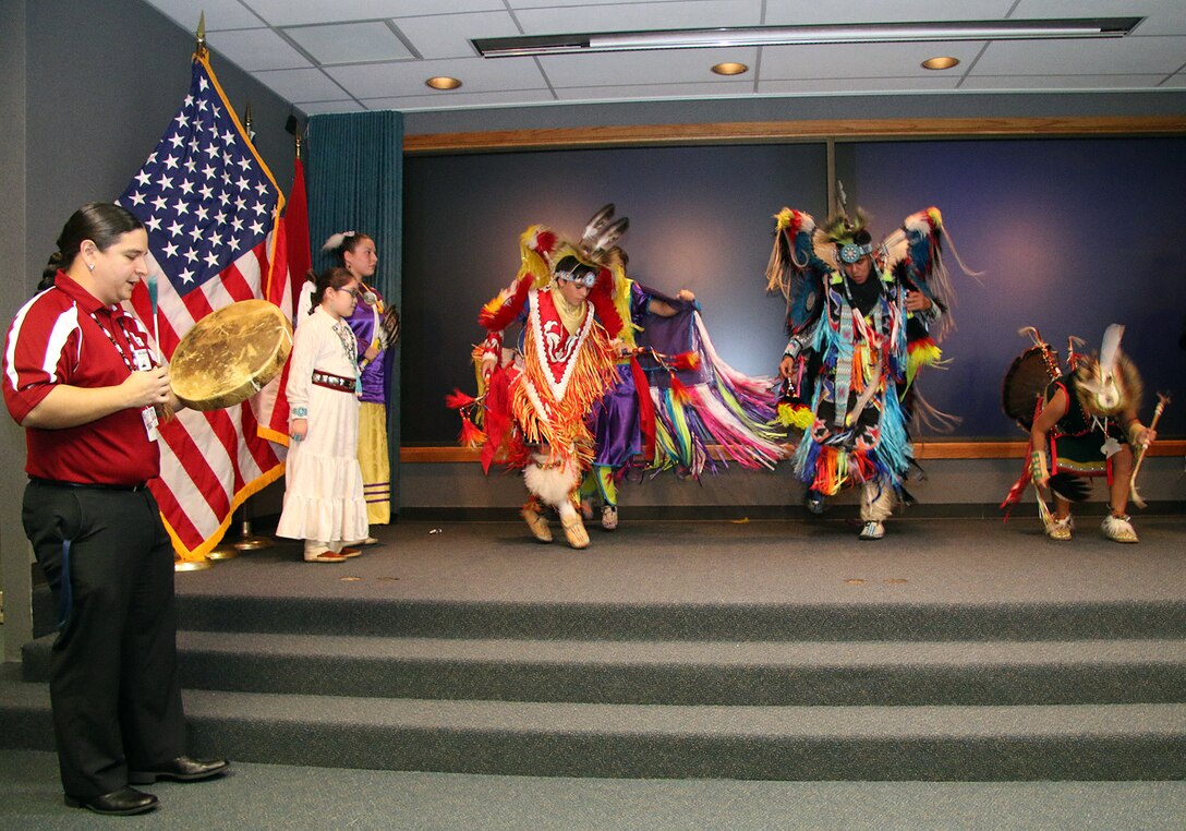 Mr. Mark Bolin, Academic Advisor for Owasso Public Schools Indian Education, beats a drum for the Owasso Indian Education Dance Group during a ceremony held Nov. 2, 2015 at the Tulsa District U.S. Army Corps of Engineers office.  The Tulsa District held the ceremony in recognition of National American Indian Heritage Month which is celebrated throughout the month of November 2015. 