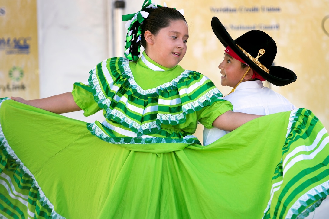 Children perform a courting dance during the annual Latino Heritage Festival in Des Moines, Iowa, Sept. 27, 2015. DoD photo by EJ Hersom