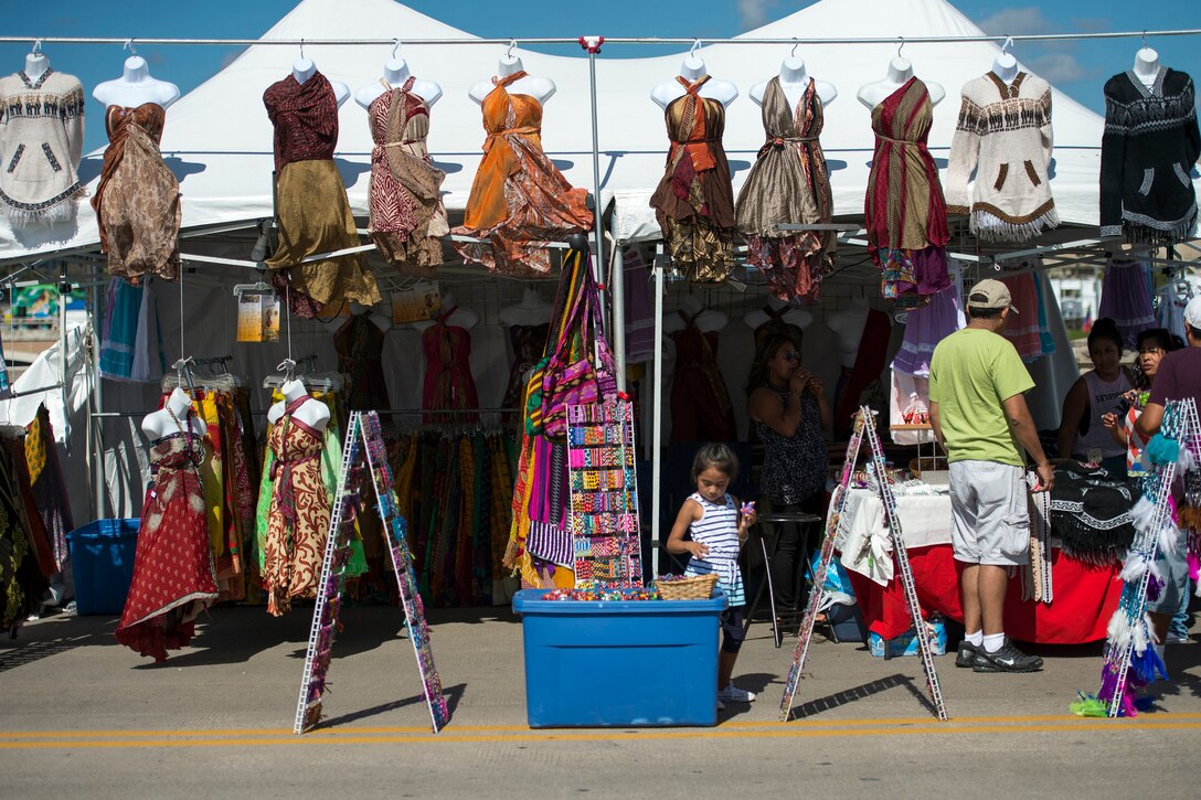 Customers browse at a clothing display during the annual Latino Heritage Festival in Des Moines, Iowa, Sept. 27, 2015. DoD photo by EJ Hersom