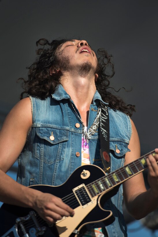 Lead guitarist and vocalist Miguel Avina of the Denver rock band Izcalli performs at the the annual Latino Heritage Festival in Des Moines, Iowa, Sept. 26, 2015. DoD photo by EJ Hersom