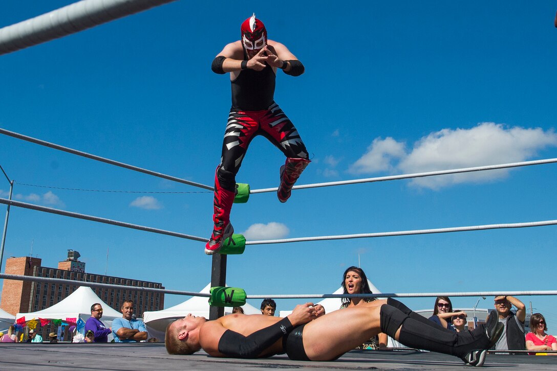 Wrestlers perform during the annual Latino Heritage Festival in Des Moines, Iowa, Sept. 27, 2015. DoD photo by EJ Hersom