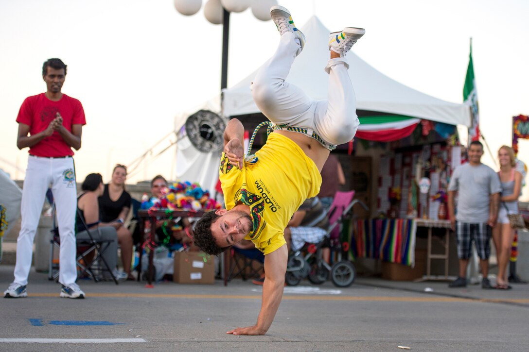 A martial arts practitioner gives a demonstration in capoeira, a Brazilian martial art, during the annual Latino Heritage Festival in Des Moines, Iowa, Sept. 26, 2015. DoD photo by EJ Hersom