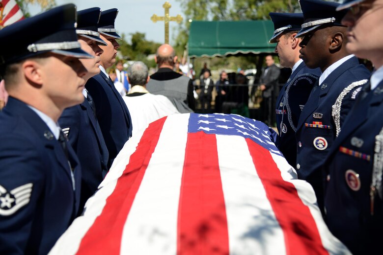 The Laughlin Honor Guard carries the casket of retired Maj. Gen. Homer Lewis in Eagle Pass, Texas, on Oct. 28, 2015. The body bearers carry the fallen to the gravesite while keeping the casket perfectly level and showing no visible signs of strain; to ensure military bearing is maintained at all times. (U.S. Air Force photo by Tech. Sgt. Steven R. Doty)(Released)