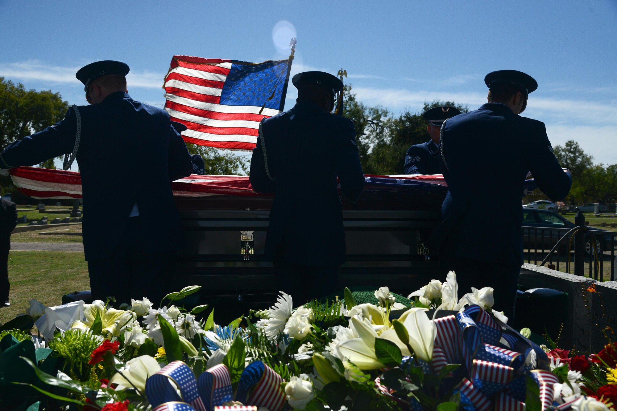 The Laughlin Honor Guard places the flag over retired Maj. Gen. Homer Lewis’s casket in Eagle Pass, Texas, on Oct. 29, 2015. Major General Homer I. "Pete" Lewis passed away peacefully at his home in Eagle Pass, Texas, Oct. 21, 2015 at the age of 96. His military decorations and awards include the Legion of Merit, Air Medal and the Air Force Outstanding Unit Award Ribbon. (U.S. Air Force photo by Airman 1st Class Brandon May)(Released)