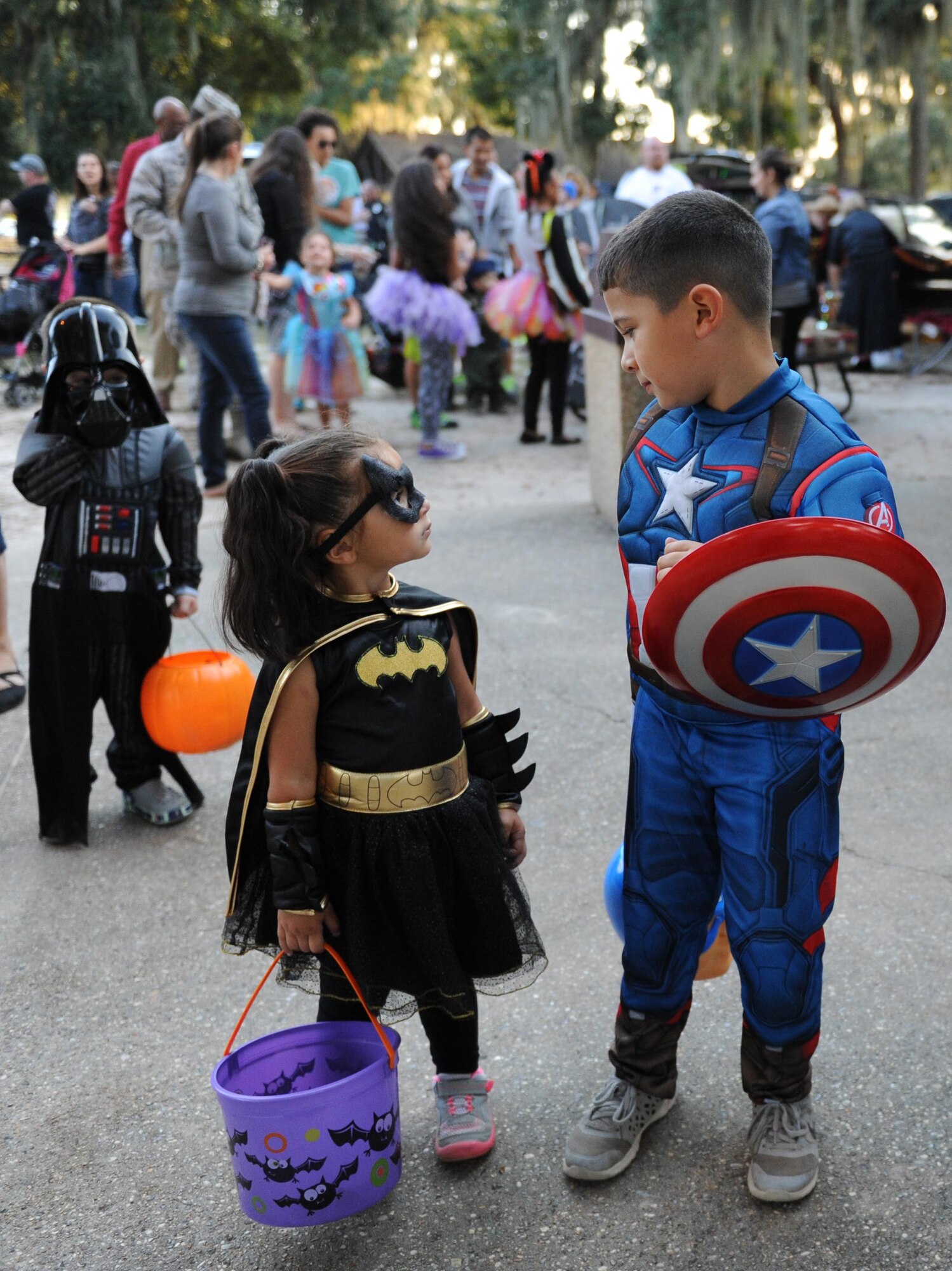 Gianna and Josiah Richard, children of Andrew Richard, Base Operations Support heating, ventilation and air conditioning mechanic, show off their Halloween costumes during Ghouls in the Park at marina park, Oct. 30, 2015, Keesler Air Force Base, Miss. Ghouls in the Park featured games with prizes, a “Trunk or Treat” and a haunted house.  (U.S. Air Force photo by Kemberly Groue)