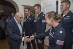 Retired Lt. Col. Richard Cole, Doolittle Raider, shakes hands with members of the U.S. Air Force Thunderbirds at his 100th birthday celebration Oct. 30, 2015, at Joint Base San Antonio-Randolph. The Doolittle Raiders were a group of 80 men who served under the command of Gen. James “Jimmy” Doolittle.  The Raiders conducted a bombing mission on Japan April 18, 1942, in retaliation for the attack on Pearl Harbor. (U.S. Air Force photo by Airman 1st Class Stormy Archer/Released)