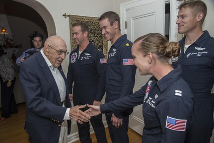Retired Lt. Col. Richard Cole, Doolittle Raider, shakes hands with members of the U.S. Air Force Thunderbirds at his 100th birthday celebration Oct. 30, 2015, at Joint Base San Antonio-Randolph. The Doolittle Raiders were a group of 80 men who served under the command of Gen. James “Jimmy” Doolittle.  The Raiders conducted a bombing mission on Japan April 18, 1942, in retaliation for the attack on Pearl Harbor. (U.S. Air Force photo by Airman 1st Class Stormy Archer/Released)