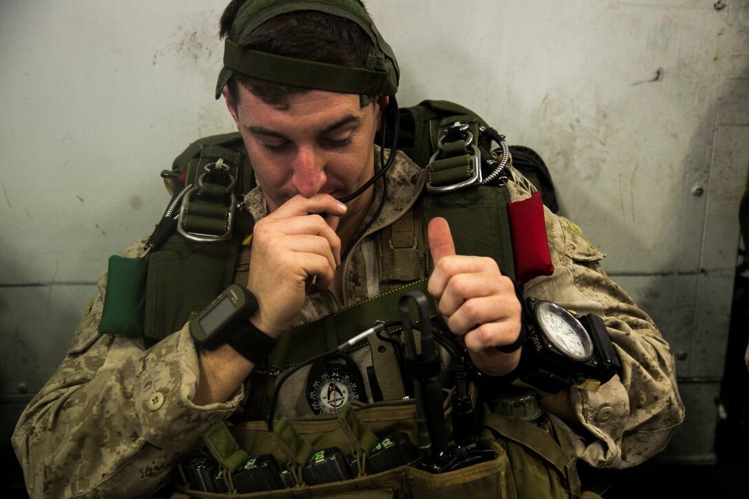 U.S. Marine Cpl. Ryan Breidenback with the Maritime Raid Force, 13th Marine Expeditionary Unit (MEU), checks his communication devices during the Composite Training Unit Exercise (COMPTUEX) aboard the USS Boxer, at sea, Oct. 29, 2015. COMPTUEX provides the MEU ARG the opportunity to integrate naval training while also allowing focused, mission-specific training and evaluation for the Marines and their Navy counter parts. (U.S. Marine Corps photo by Cpl. Briauna Birl/RELEASED)