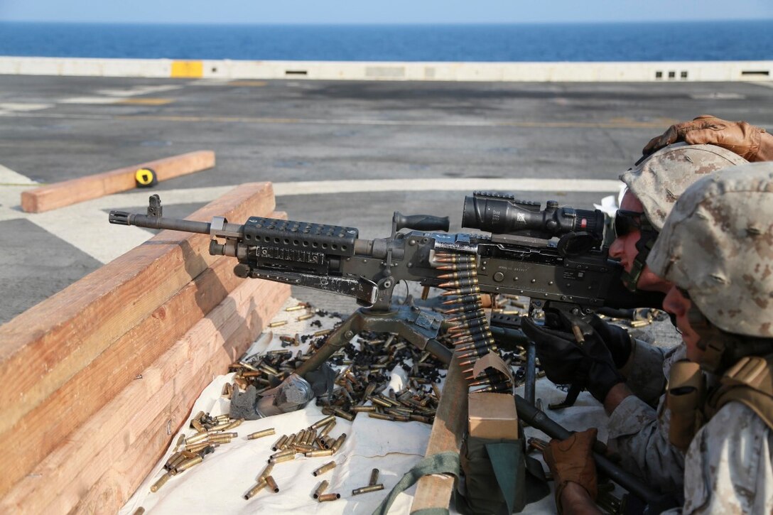 GULF OF ADEN (Oct. 29, 2015) U.S. Marine Cpl. Brandon Galatro fires an M240B machine gun on the flight deck of the amphibious transport dock ship USS Anchorage (LPD 23). Galatro is a supply warehouse man with Combat Logistics Battalion 15, 15th Marine Expeditionary Unit. The 15th MEU, embarked on the ships of the Essex Amphibious Ready Group, is deployed to maintain regional security in the U.S. 5th Fleet area of operations. (U.S. Marine Corps photo by Sgt. Steve H. Lopez/Released)