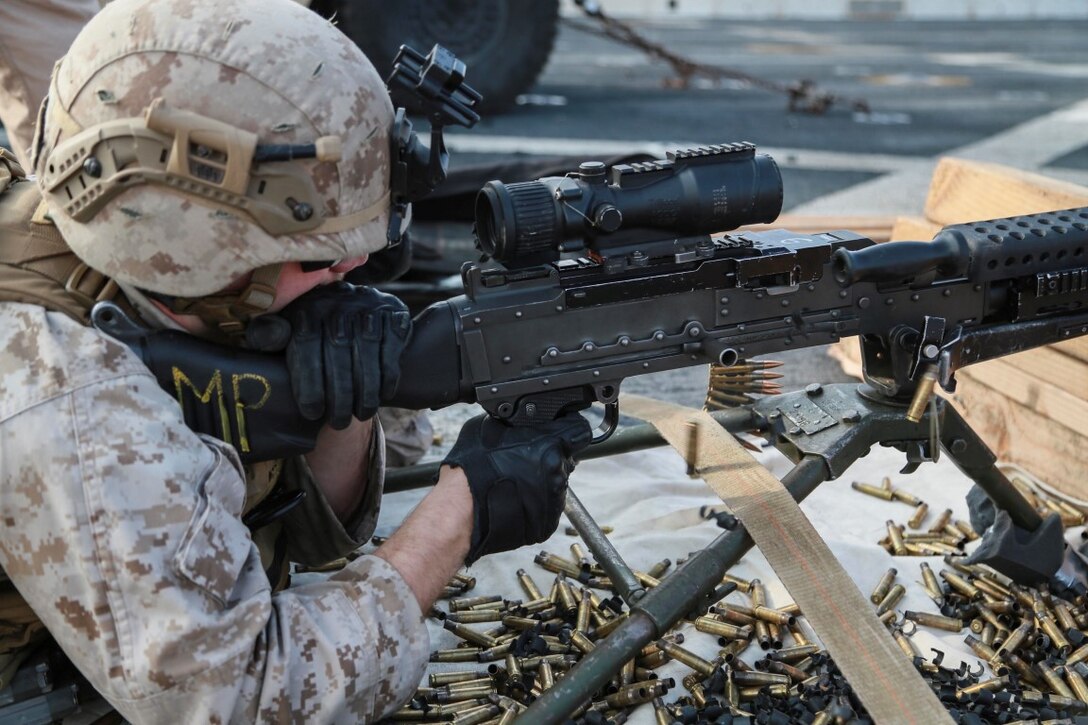 GULF OF ADEN (Oct. 29, 2015) U.S. Marine Cpl. Timothy Costello fires an M240B machine gun on the flight deck of the amphibious transport dock ship USS Anchorage (LPD 23). Costello is a military police officer with Combat Logistics Battalion 15, 15th Marine Expeditionary Unit. The 15th MEU, embarked on the ships of the Essex Amphibious Ready Group, is deployed to maintain regional security in the U.S. 5th Fleet area of operations. (U.S. Marine Corps photo by Sgt. Steve H. Lopez/Released)