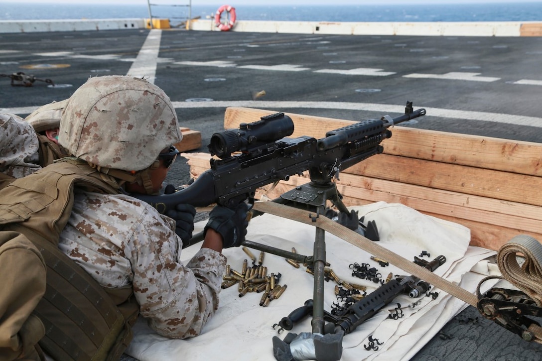 GULF OF ADEN (Oct. 29, 2015) U.S. Marine Cpl. LaNita Moss fires an M240B machine gun on the flight deck of the amphibious transport dock ship USS Anchorage (LPD 23). Moss is a motor transport operator with Combat Logistics Battalion 15, 15th Marine Expeditionary Unit. The 15th MEU, embarked on the ships of the Essex Amphibious Ready Group, is deployed to maintain regional security in the U.S. 5th Fleet area of operations. (U.S. Marine Corps photo by Sgt. Steve H. Lopez/Released)