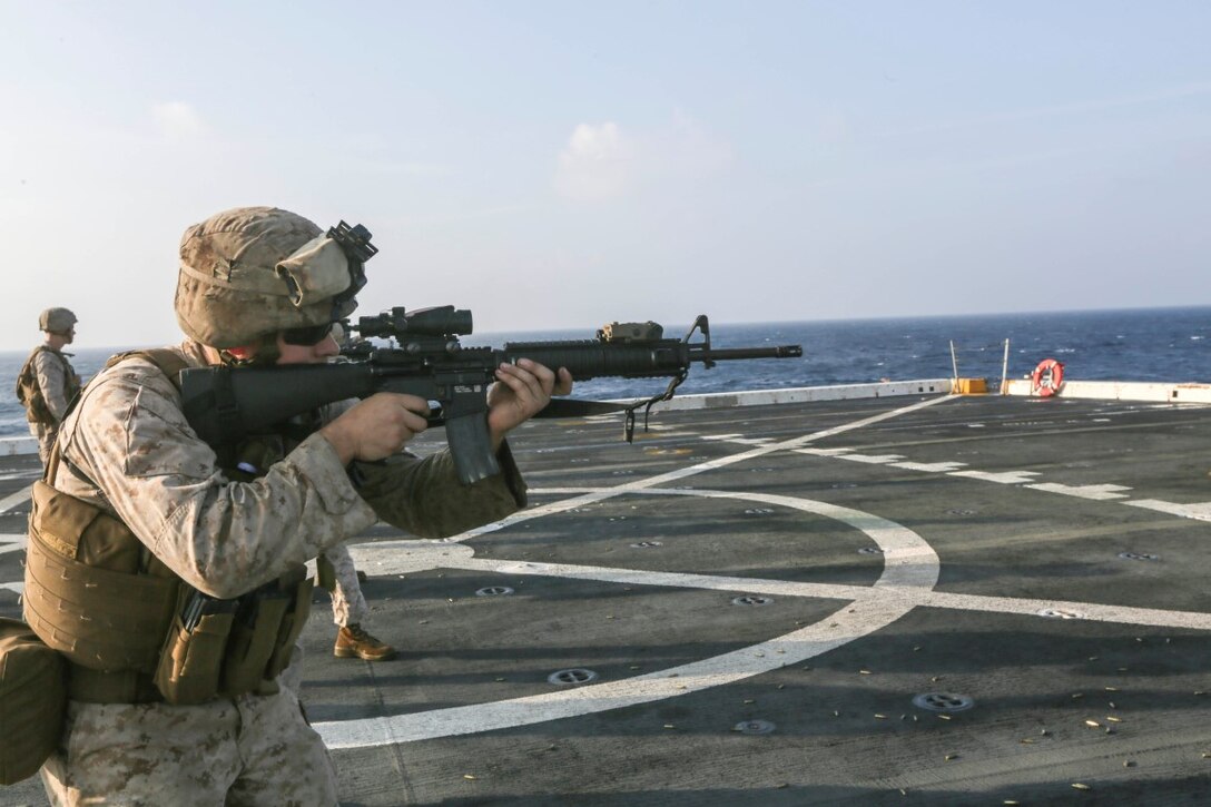GULF OF ADEN (Oct. 31, 2015)  U.S. Marine Sgt. Rodney Gleisner fires an M16A4 rifle during a deck shoot aboard the amphibious transport dock ship USS Anchorage (LPD 23).  Gleisner is a motor transport mechanic with Combat Logistics Battalion 15, 15th Marine Expeditionary Unit.  The 15th MEU, embarked on the ships of the Essex Amphibious Ready Group, is deployed to maintain regional security in the U.S. 5th Fleet area of operations.  (U.S. Marine Corps photo by Sgt. Jamean Berry/Released)