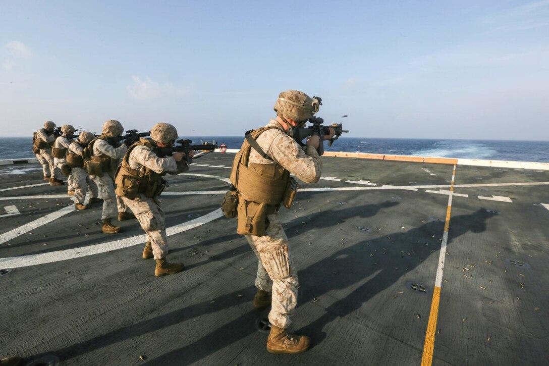 GULF OF ADEN (Oct. 31, 2015)  U.S. Marines with Combat Logistics Battalion 15, 15th Marine Expeditionary Unit fire M16A4 rifles during a deck shoot aboard the amphibious transport dock ship USS Anchorage (LPD 23). The 15th MEU, embarked on the ships of the Essex Amphibious Ready Group, is deployed to maintain regional security in the U.S. 5th Fleet area of operations. (U.S. Marine Corps photo by Sgt. Jamean Berry/Released)