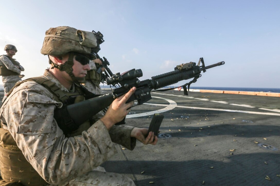 GULF OF ADEN (Oct. 31, 2015)  U.S. Marine Sgt. Rodney Gleisner reloads an M16A4 rifle during a deck shoot aboard the amphibious transport dock ship USS Anchorage (LPD 23). Gleisner is a motor transport mechanic with Combat Logistics Battalion 15, 15th Marine Expeditionary Unit. The 15th MEU, embarked on the ships of the Essex Amphibious Ready Group, is deployed to maintain regional security in the U.S. 5th Fleet area of operations.  (U.S. Marine Corps photo by Sgt. Jamean Berry/Released)