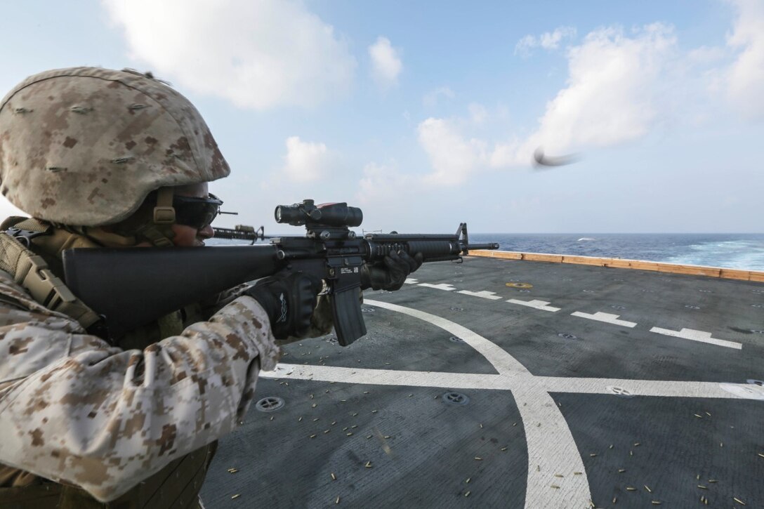 GULF OF ADEN (Oct. 31, 2015)  U.S. Marine Cpl. LaNita Moss fires an M16A4 during a deck shoot aboard the amphibious transport dock ship USS Anchorage (LPD 23). Moss is a motor transport operator with Combat Logistics Battalion 15, 15th Marine Expeditionary Unit. The 15th MEU, embarked on the ships of the Essex Amphibious Ready Group, is deployed to maintain regional security in the U.S. 5th Fleet area of operations. (U.S. Marine Corps photo by Sgt. Jamean Berry/Released)