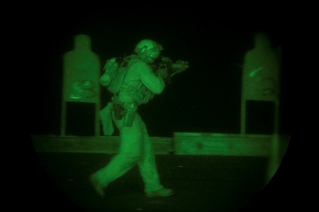 INDIAN OCEAN (Oct. 31, 2015) A U.S. Marine with the 15th Marine Expeditionary Unit’s Maritime Raid Force aims at his target during a deck shoot aboard the amphibious assault ship USS Essex (LHD 2). The Marines practiced shooting on the move at multiple targets to create more realistic drills and increase their speed and accuracy. The 15th MEU, embarked on the ships of the Essex Amphibious Ready Group, is deployed to maintain regional security in the U.S. 5th Fleet area of operations. (U.S. Marine Corps photo by Sgt. Anna Albrecht/Released)