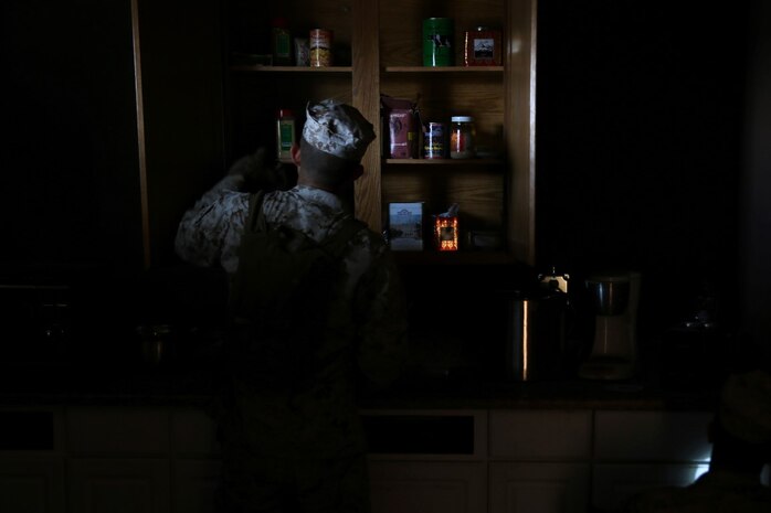 Marines with Headquarters and Service Company, 1st Battalion, 5th Marine Regiment, 1st Marine Division, search through cabinets for simulated enemy munitions during searchers and site exploitation training aboard Marine Corps Base Camp Pendleton, Calif., Oct. 29, 2015. Instructors with the Marines Corps Engineer Society taught the Marines the skills they need to locate and collect evidence on munitions or against suspected individuals in a realistic training environment.