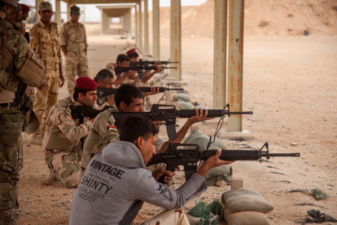 Soldiers with the 7th Iraqi Army Division fire M16A4 rifles during advanced marksmanship training at Al Asad Air Base, Iraq, Oct. 25, 2015. Royal Danish Army soldiers train the Iraqi soldiers as part of Combined Joint Task Force - Operation Inherent Resolve’s building partner capacity mission. More than 60 coalition partners have committed themselves to the goals of eliminating the threat posed by the Islamic State of Iraq and the Levant and have contributed invarious capacities to the effort to combat ISIL in Iraq, the region and beyond. (U.S. Marine Corps photo by Cpl. Akeel Austin/Released)